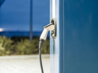 EV charging port close-up at night
