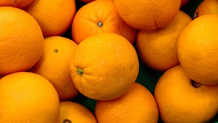 Fresh sweet and sour tangerines, a popular citrus fruit characterized by its round shape, vibrant orange or yellow color, and leathery, oily skin