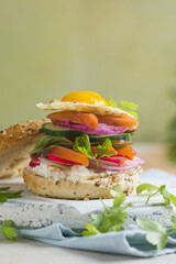 Bagel with salmon, egg, and fresh greens