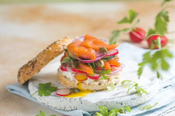 Bagel with salmon, egg, and fresh greens