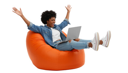 Joyful freelancer: A young woman celebrates success in a beanbag chair with her laptop isolated