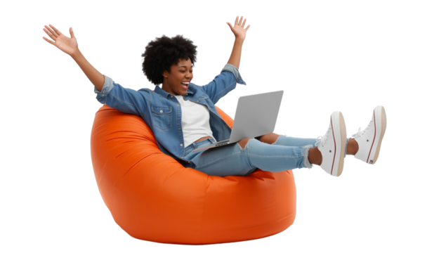 Joyful freelancer: A young woman celebrates success in a beanbag chair with her laptop isolated