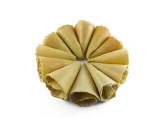 Semprong cake, sapit, sepit, Dutch cake, gapit, kassipi, kapit, Asian egg roll. A waffle or pastry snack originating from Indonesia. Semprong cake isolated on a white background.