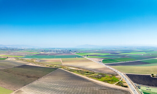 Panoramic drone view of Watsonville, California with agriculture fields 