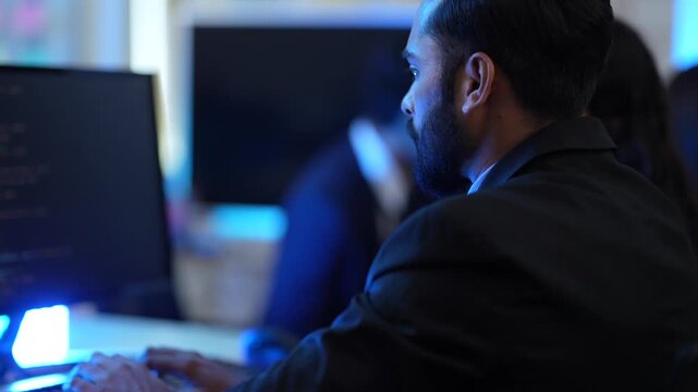 A lead data scientist presents the results of a machine learning model, explaining the algorithm's architecture and performance metrics during a late-night AI development session.