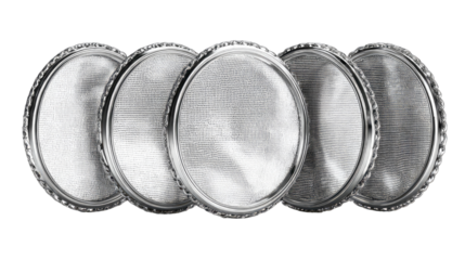 Oval silver plates with shadowed profiles