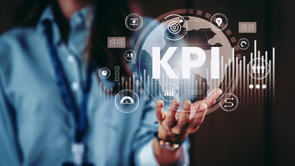 Business woman hand holding KPI, key performance indicators) icon for business to measure and evaluate progress and performance analysis goals and making decisions