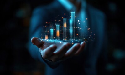 Person holding a glowing digital bar chart hologram with rising columns and data points in a dark setting, symbolizing growth and technology