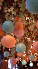 Lanterns adorn a ceiling with vines & soft lights