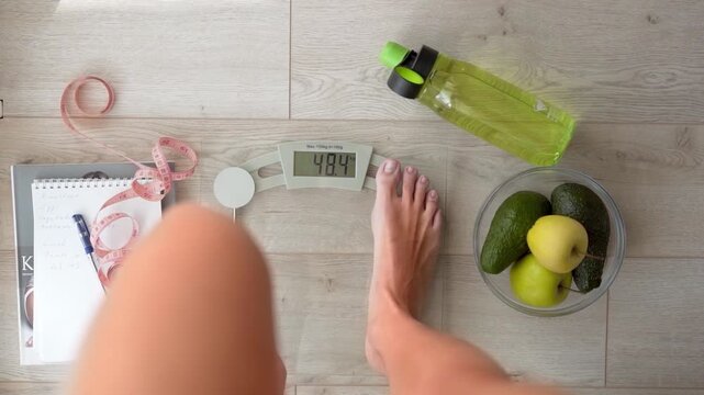 skinny girl's lean legs showing perfect weight, closeup 4k video