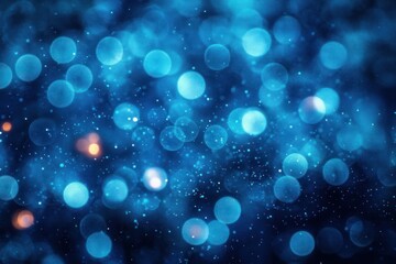 Abstract glowing blue bokeh lights with soft focus and scattered small light particles creating a dreamy and magical atmosphere