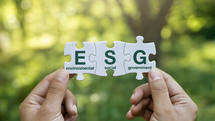Hands connect ESG puzzle pieces promoting sustainable business practices