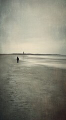 Solitary figure on bleak beach