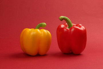 Capsicum bell pepper red yellow on red background