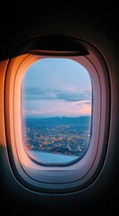 Airplane window view city lights twinkle below a pastel sky, as warm sunset light illuminates the frame's edge, creating a serene airborne perspective