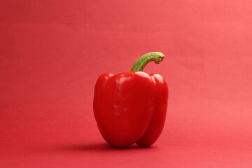 Capsicum bell pepper red yellow on red background