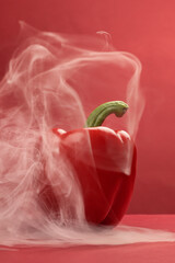 Capsicum bell pepper smoke fume vapour red yellow on red background