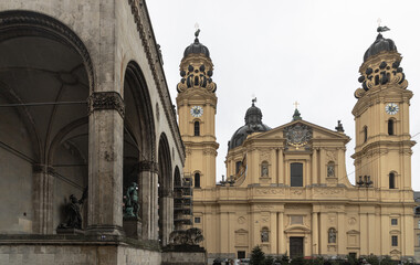 Fototapeta premium View of The Theatine Church of St. Cajetan and Adelaide (Theatinerkirche St. Kajetan und Adelheid) a Catholic church on Odeonsplatz in Munich. Space for text, Selective focus.