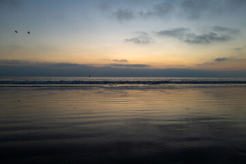 Beautiful sunrise, sun, blue sky with cloud and the sea landscape.