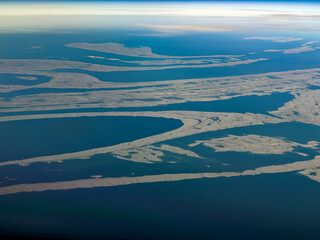 aerial landscape view of Belcher Islands group with Flaherty Island, the largest island of the Belcher Islands group located in Hudson Bay, Qikiqtaaluk Region, Nunavut, Canada 