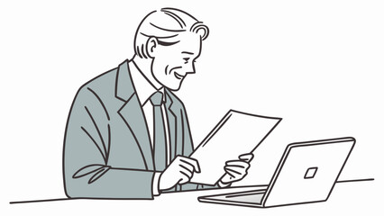 Businessman reviewing documents at his desk with laptop computer.