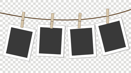 Four blank photo frames hanging on a clothesline with clothespins mockup template for design.