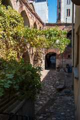 Historic Ottoman caravanserai inn courtyard with stone arches and workshops in Istanbul Turkey showing traditional architecture and cultural heritage site