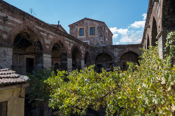 Obraz premium Historic Ottoman caravanserai inn courtyard with stone arches and workshops in Istanbul Turkey showing traditional architecture and cultural heritage site