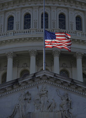 Fototapeta premium Washington DC Capitol near American flag. USA flag over Congress. Historic federal government building with US flag. Symbol of American democracy. Congress front of waving American flag.