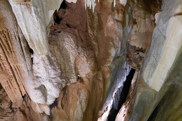 Stunning cave interior with stalactites and stalagmites formation in underground cavern
