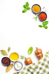 Food, cooking, spices background, chili pepper and turmeric, olive oil, salt and peppercorn, kitchen towel, spice grinder, utensils, white copy space, top view