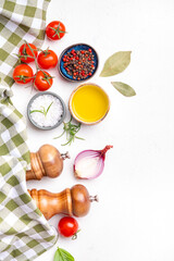 Eat healthy, cook delicious. Food background, spices, basil, rosemary, tomato - ingredients for healthy eating and cooking, white copy space, top view