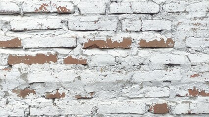 Close-up of an old white painted brick wall with a rustic, weathered texture. The peeling paint and natural imperfections create a vintage look, perfect as a background, wall texture, or design materi