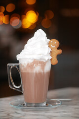 Hot cocoa with whipped cream and gingerbread