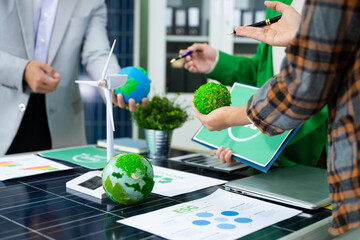 Business team people planning hand using laptop for working technology and business Net zero and...