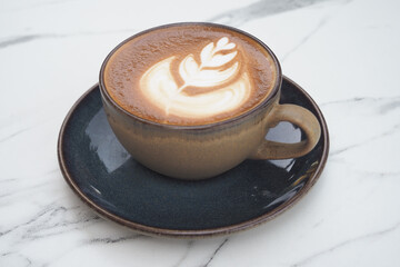 Freshly brewed latte art in a cozy cafe setting