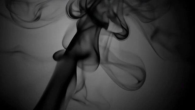 Dynamic swirls of thick black smoke rising against a soft gray background, creating an artistic and abstract visual effect