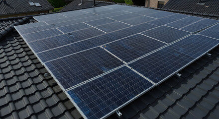 Solar panels installed on a dark tiled roof, generating clean energy for a sustainable future.
