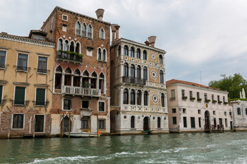 Venice, Italy - August 22, 2019: Architecture and facade of the old city buildings of Venice
