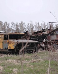 Fototapeta premium Rusty military vehicles abandoned in field
