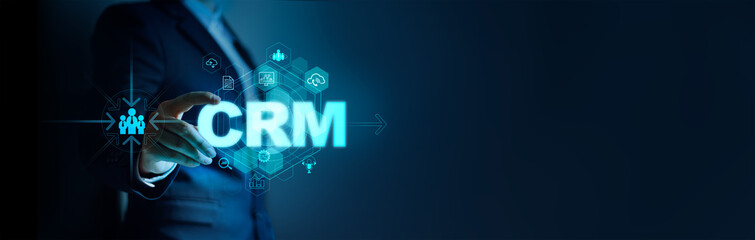 Businessman hold word CRM for improve customer relationships through and data business analysis and metrics connected to the database customers, Technology and strategy for marketing, Finance, Banking
