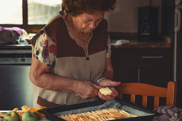 senior woman preparing a dessert or cake at home