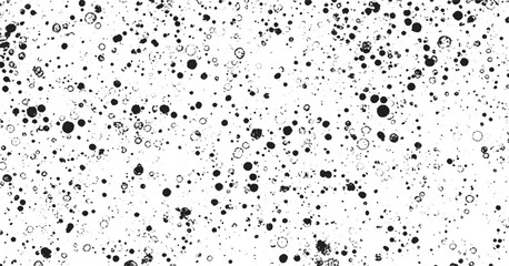 Abstract black and white speckled dotted pattern with playful organic texture