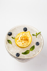 top view of a lemon passette dessert on ice on a white background