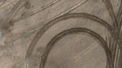 Aerial top view tire track on dirt sand mud, Texture of wet mud road with puddle and Tyre or tire...