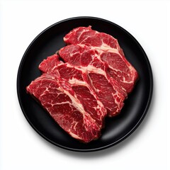 Fototapeta premium Raw Beef Steaks on Black Plate , white background cut out PNG