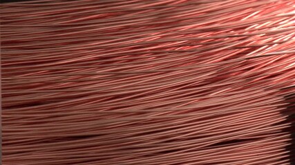 Closeup of Copper Cable being Rolled up in Preparation for Shipment at the Factory. Production of copper wire, cable in reels at factory. Cable factory. - Powered by Adobe