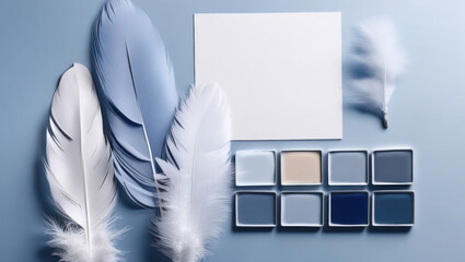 Feathers and paint samples in shades of blue and white create serene composition