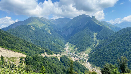 Naklejka premium Aerial view from the cable car in Gabala to the peaks of the mountains, green slopes and beautiful landscapes of the Caucasus, Azerbaijan