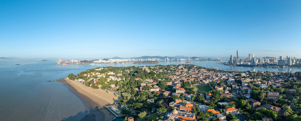 Gulangyu island reveals its coastal beauty and cityscape, showcasing the vibrant life of Xiamen, China.